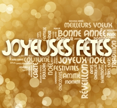 Nuage de mots blanc sur fond doré contenant notamment les termes « Joyeuses fêtes », « Bonne année », « Réveillon », « Noël », « Amitié », « Paix » et « Harmonie ».